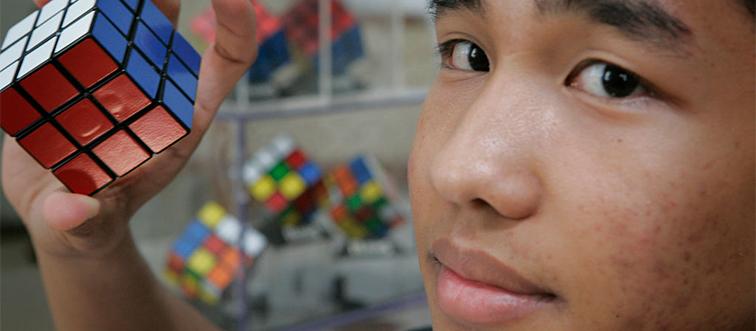 a boy holding a popular 80s toy