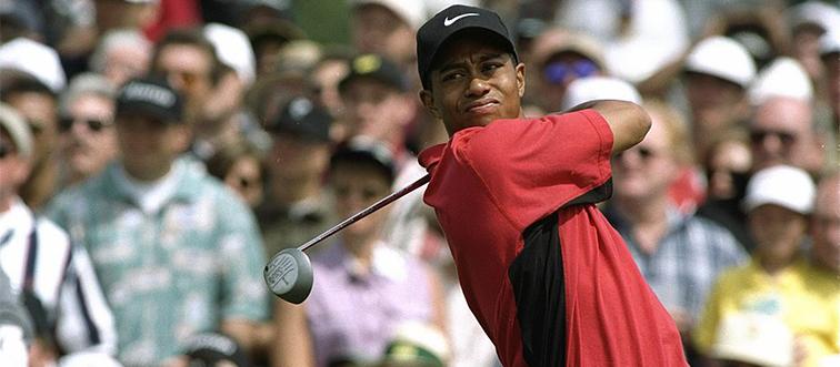 tiger woods teeing off during a golf competition