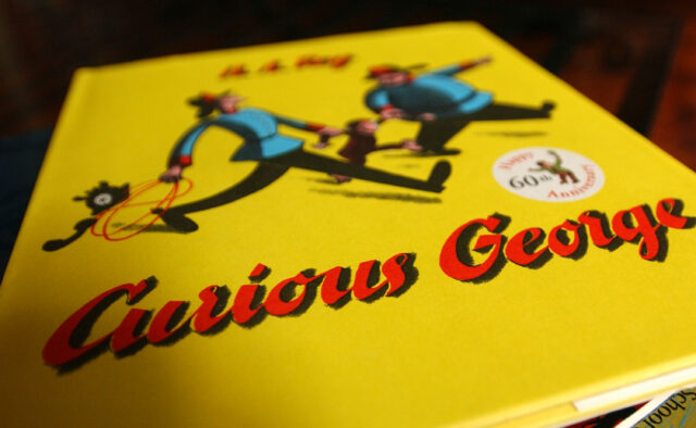 The book cover of 'Curious George'