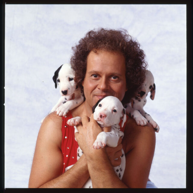 Portrait of Richard Simmons with Dalmatian puppies