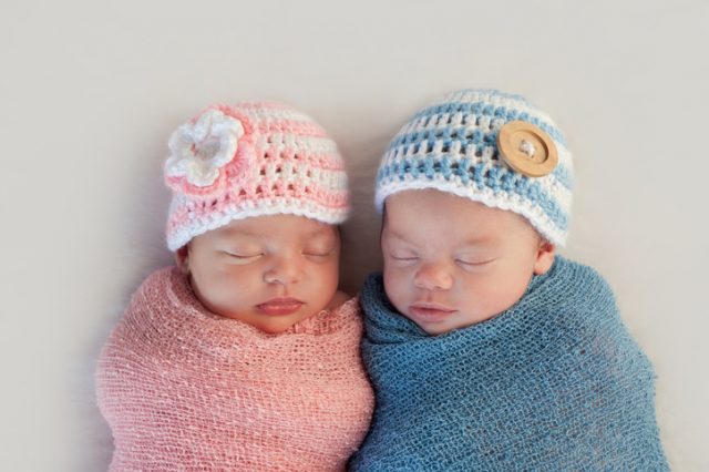 Five week old twins newborn wearing pink and blue – boy or girl?