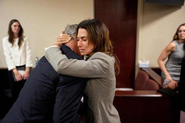 Hilaria Baldwin hugging Alec Baldwin in a courtroom