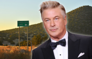 Sign along the side of a desert road + Alec Baldwin wearing a suit