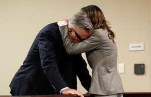 Hilaria Baldwin hugging Alec Baldwin in a courtroom