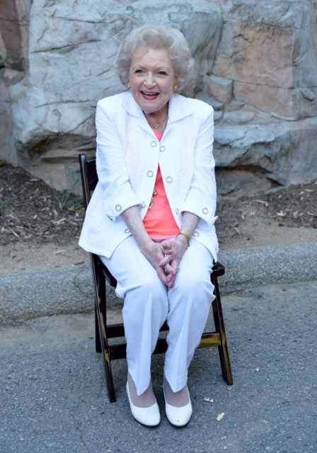 Betty White sitting in a chair