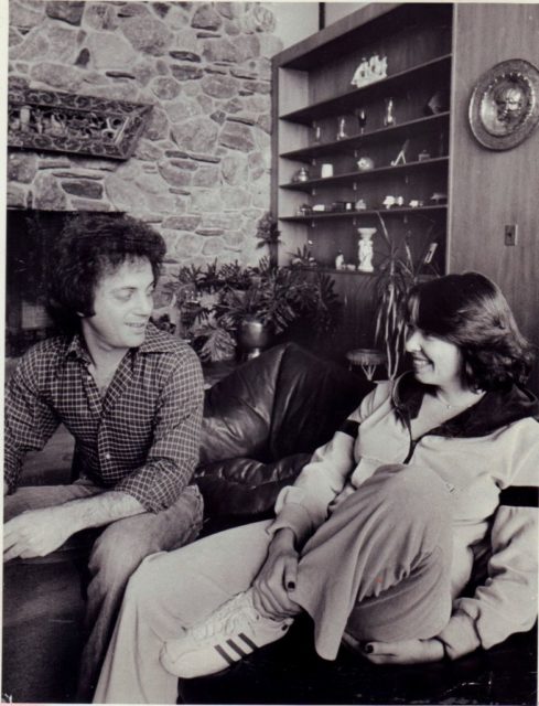 Billy Joel and Elizabeth Weber sitting in their living room