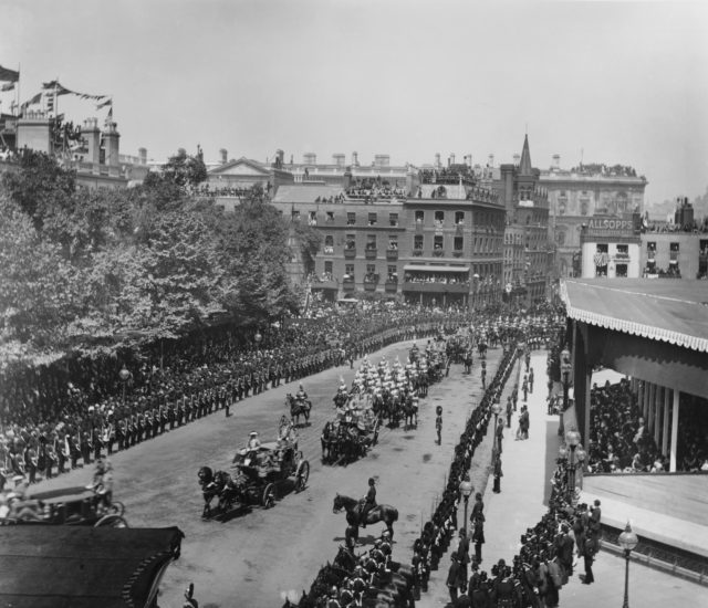 Aerial view of Queen Victoria's golden jubilee procession, with people crowded along the street