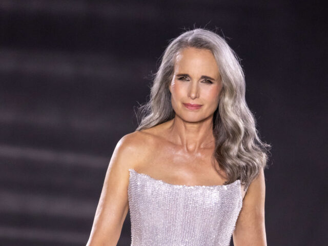 Andie MacDowell walking on a catwalk