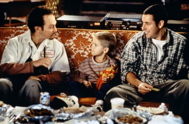 Schnieder and Adam Sandler on a couch in 'Big Daddy'