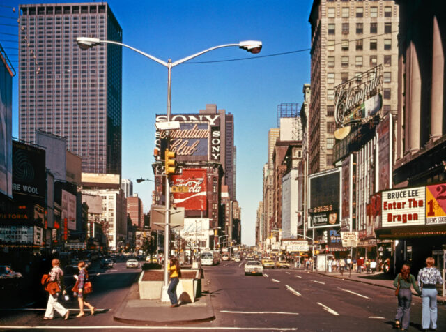 Cars and people moving through Times Square, New York City