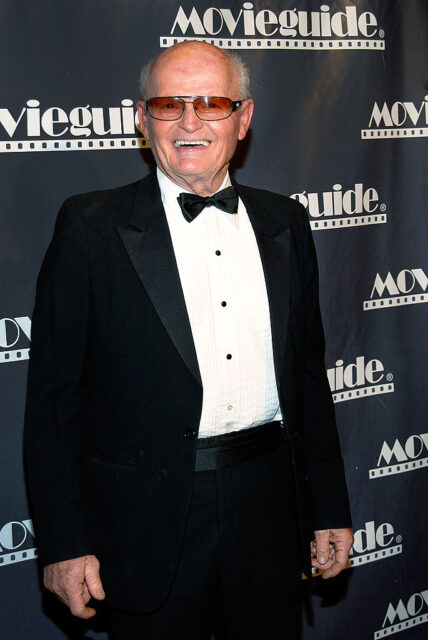 Bob Yerkes standing on a red carpet