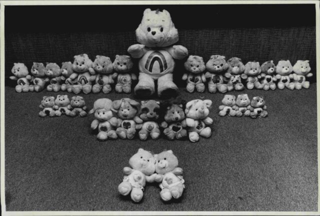 Care Bears lined up together on the floor