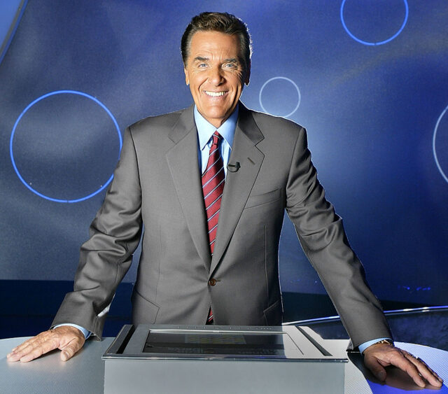 Chuck Woolery standing on the set of 'Lingo'