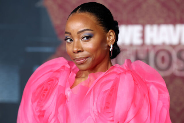 Erica Ash standing on a red carpet