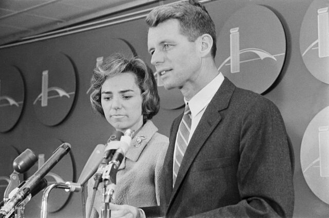 Ethel and Robert Kennedy standing at a podium