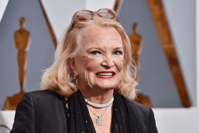 Gena Rowlands standing on a red carpet