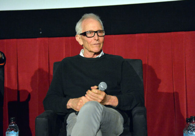 Jim Abrahams sitting on stage