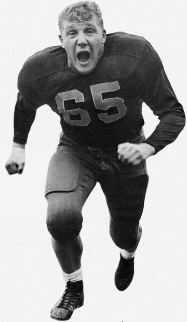 Joe Schmidt running in his football uniform