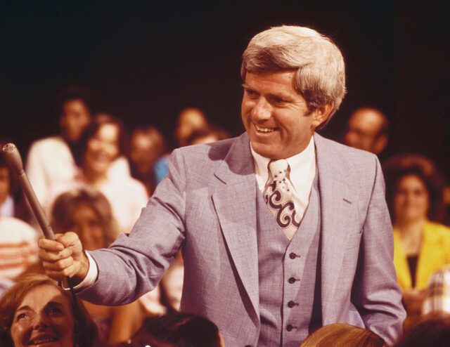 Phil Donahue standing on the set of 'The Phil Donahue Show'