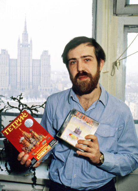 Alexey Pajitnov holding two versions of Tetris.