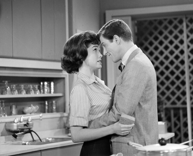 Mary Tyler Moore and Dick Van Dyke in an embrace.