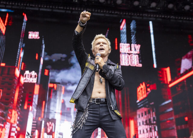 Billy Idol performing on stage.