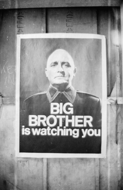 A poster that reads "Big Brother is watching you."