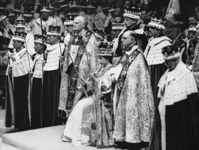 Queen Elizabeth II during her coronation, surrounded by people.