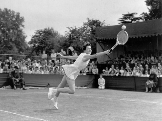 margaret court mid serve on tennis court
