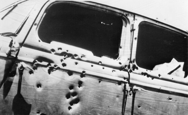 A car with bullet holes.