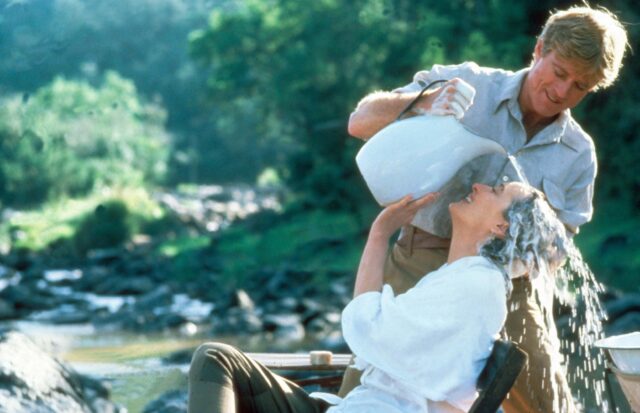 Robert Redford washing Meryl Streep's hair in a river.