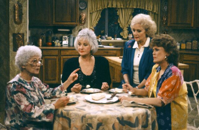 The cast of the 'Golden Girls' sitting at their kitchen table.