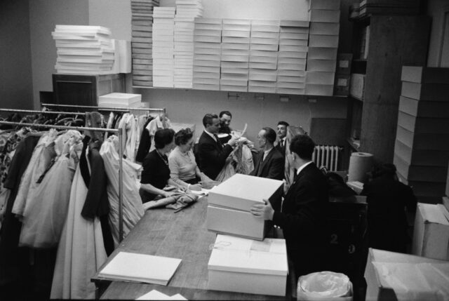 Models and staff working backstage at the 1955 Christian Dior fashion shows