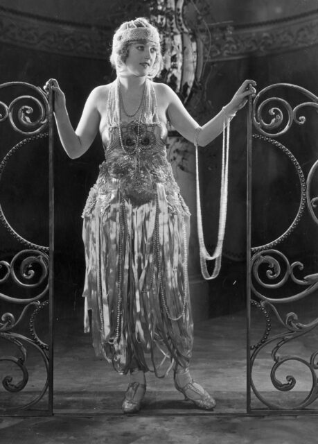 Marion Davies in silent film 1920s costume.
