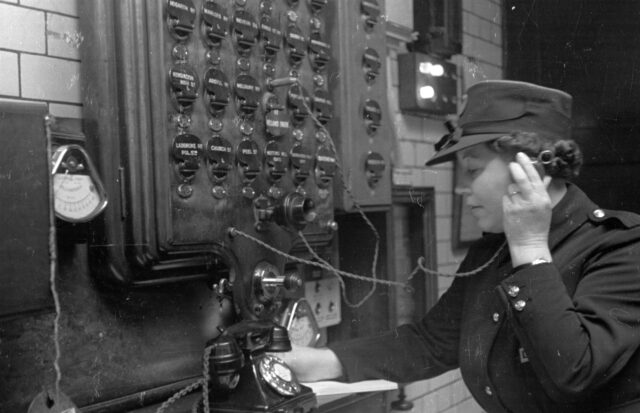 A telephone operator working at her station.
