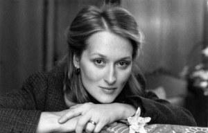 Meryl Streep resting her head in her hands.