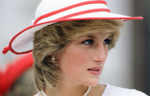 Profile shot of Princess Diana wearing a hat.