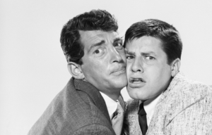 Dean Martin and Jerry Lewis cheek-to-cheek.