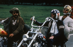 Dennis Hopper, Peter Fonda, and Jack Nicholson riding motorcycles in 'Easy Rider.'