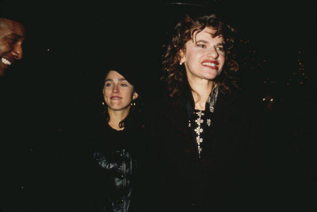 Madonna and Sandra Bernhard walking together at night