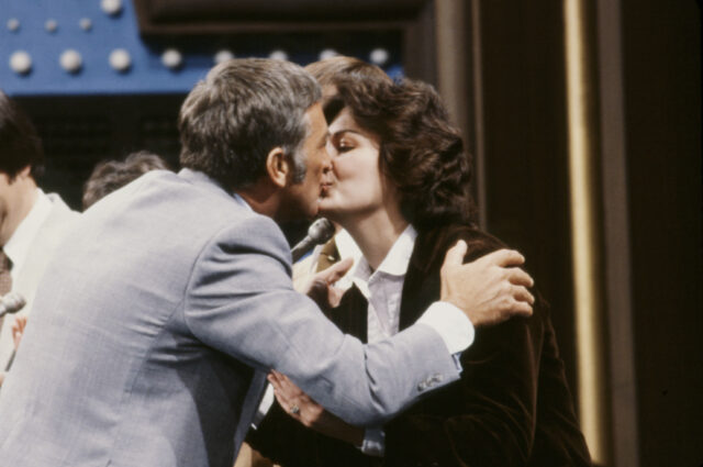 Richard Dawson kissing a contestant.