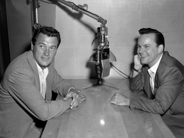 Bob Crane and Rock Hudson at a radio microphone.