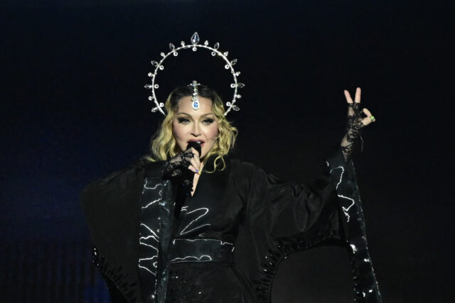 Madonna singing into a microphone.