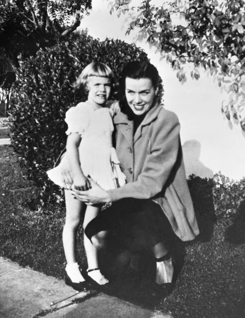 Jean Spangler standing with her daughter, Christine, near a sidewalk