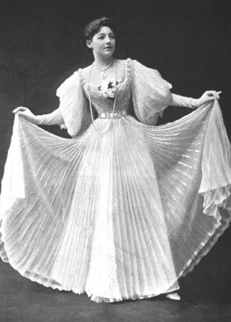 Portrait of May Yohé standing in her wedding dress