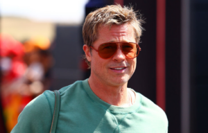 Brad Pitt walking through the Formula One paddock