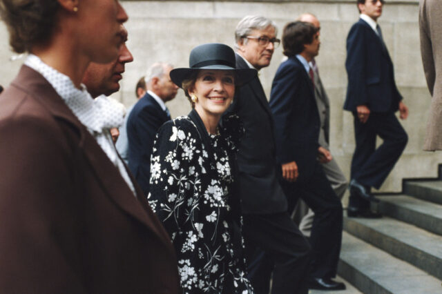 First Lady Nancy Reagan walking with others up a flight of stairs