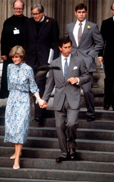 Lady Diana Spencer and Prince Charles walking down stairs with other people