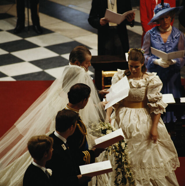 Edward John, 8th Earl Spencer; Prince Andrew; Lady Diana Spencer; and Prince Charles standing together at the altar at St. Paul's Cathedral