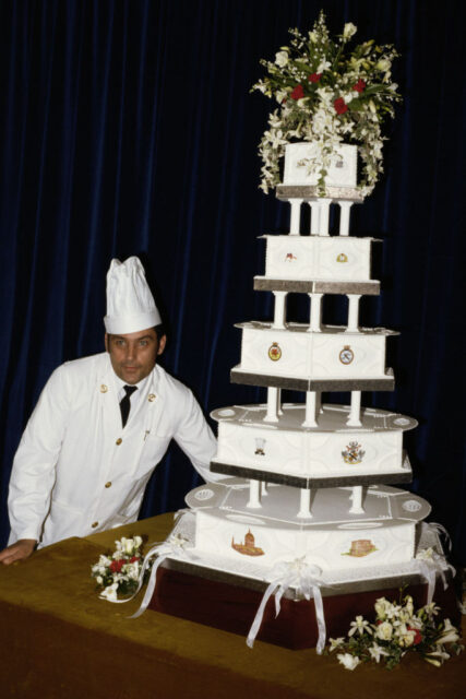 Chief Petty Officer cook David Avery standing with a wedding cake